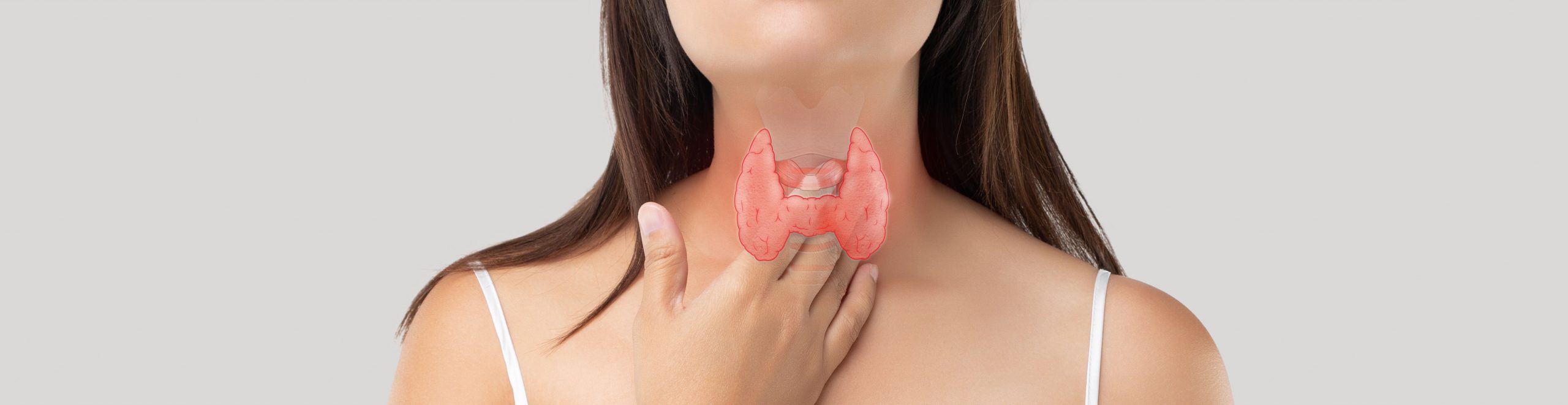 lady touching her thyroid