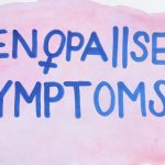 Menopause Symptoms written on a cardboard